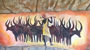 A cave wall with a painted scene of a hunter and antelopes. - Rwizi View Hotel Mbarara (Mbarara)