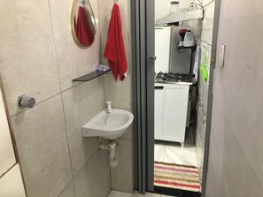 Shower, towels, soap, toilet paper