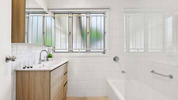 Shower, hair dryer, towels, shampoo