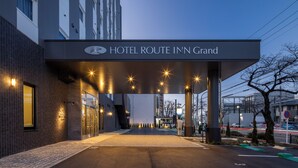 A hotel entrance with a sign reading "HOTEL ROUTE INN Grand". - HOTEL ROUTE-INN Grand NAGOYA FUJIGAOKA EKIMAE (Nagoya)