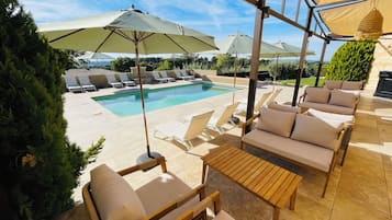 Outdoor pool, open 8:00 AM to 8:00 PM, pool loungers