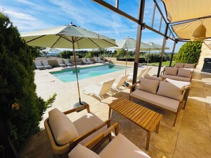 Outdoor pool, open 8:00 AM to 8:00 PM, pool loungers
