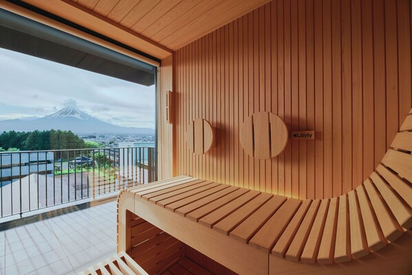 A wooden interior with a view of a mountain. - edit x seven FUJI GOTEMBA (Gotemba)