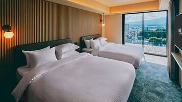 A hotel room with two beds, a large window with a city view, and a wooden panel wall.