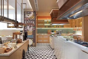 A modern kitchen with a checkered floor, a central island, and a vertical banner with text.