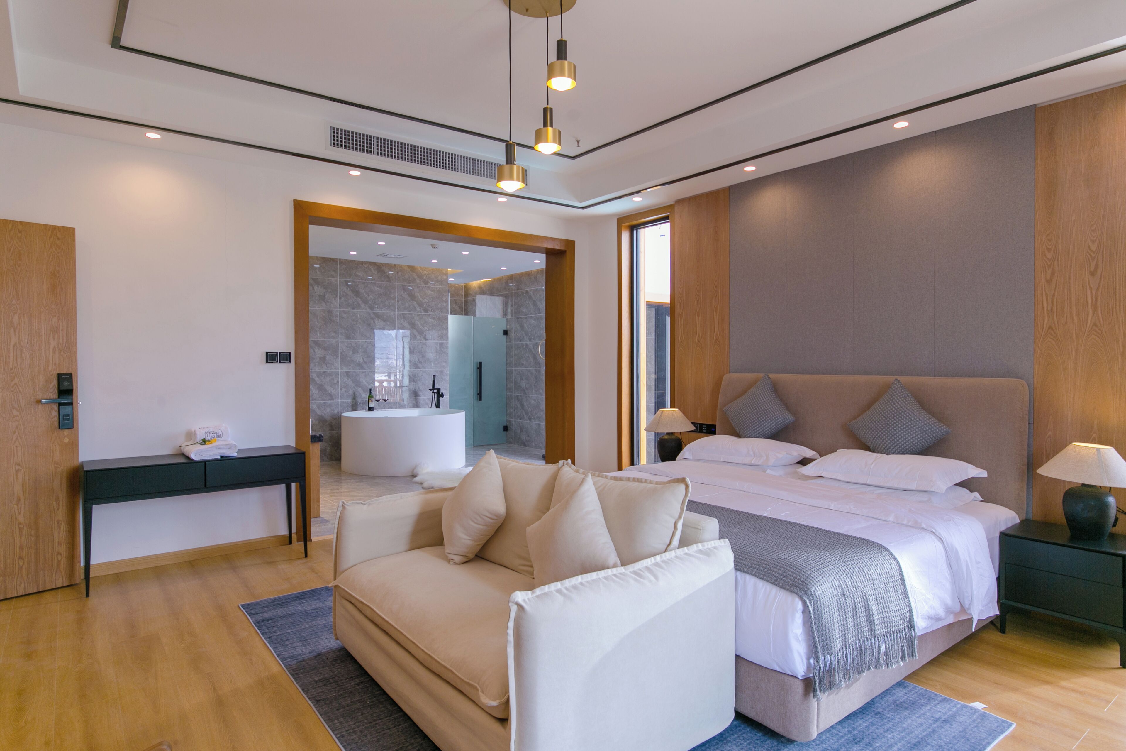 Deluxe Suite, Balcony, Garden View | Desk, blackout drapes, soundproofing, iron/ironing board