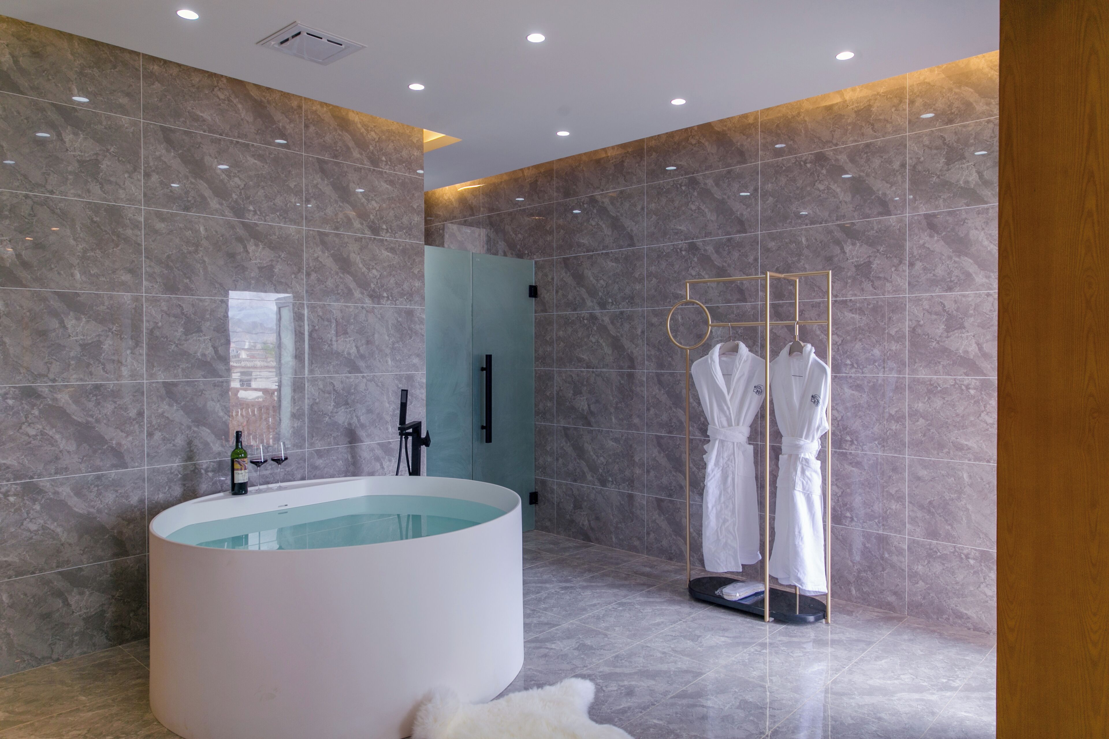 Separate tub and shower, hair dryer, slippers, towels