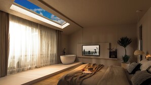 Ein modernes Schlafzimmer mit Dachfenster, einem großen Bett, einer integrierten Badewanne und Blick auf die Stadt durch ein Fenster.