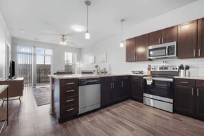 Fridge, microwave, oven, stovetop - CozySuites Modern 2BR, Nora Indianapolis #11 (Indianapolis)