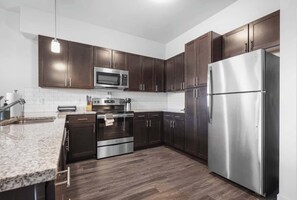 Fridge, microwave, oven, stovetop - CozySuites Modern 2BR, Nora Indianapolis #11 (Indianapolis)