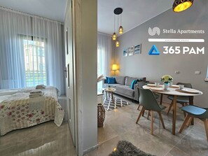 Departamento Confort | Área de sala de estar | Televisión LCD de 50 pulgadas con canales por cable 