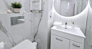 Apartamento conforto | Banheiro | Secador de cabelo, toalhas de banho