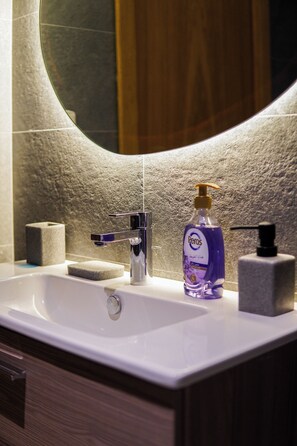 Shower, towels, soap, toilet paper