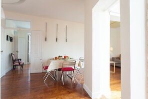 Family Apartment, City View | Living area | 27-inch flat-screen TV with digital channels