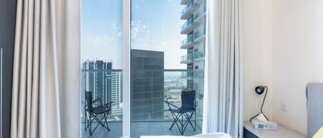 Deluxe Studio, City View | In-room safe, desk, laptop workspace, blackout drapes