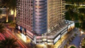 A modern hotel with a unique, curved tower design, featuring multiple floors and a central atrium. - CaiCai Homes AG Tower Business Bay (Dubai)