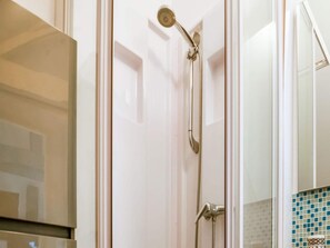 A shower with a handheld showerhead and a wall-mounted faucet. - Romantic Stay, Isigny-sur-Mer (Isigny-sur-Mer)