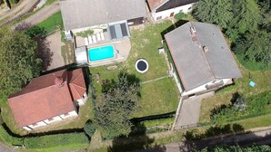 An aerial view of a residential property with a swimming pool, a fenced yard, and a circular driveway. - Villa in Zelenecká Lhota with Private Pool (Liban)