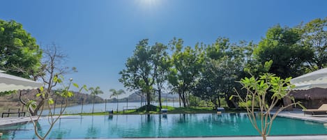 Outdoor pool, open 8:00 AM to 8:00 PM, pool umbrellas, pool loungers