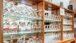 A store with shelves of various glassware, including wine glasses and bottles. - Holiday home with sauna in the Eifel National Park (Schleiden)