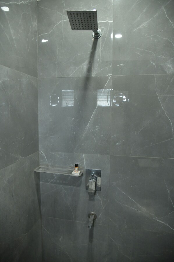 A modern shower with a square showerhead and a control panel. - HOTEL M PLAZA DHULAGAR HOWRAH (Howrah)