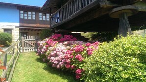 A rustic building with a stone facade and a wooden balcony. - Mansion in Nava with Pool & Terrace (Nava - Asturias)