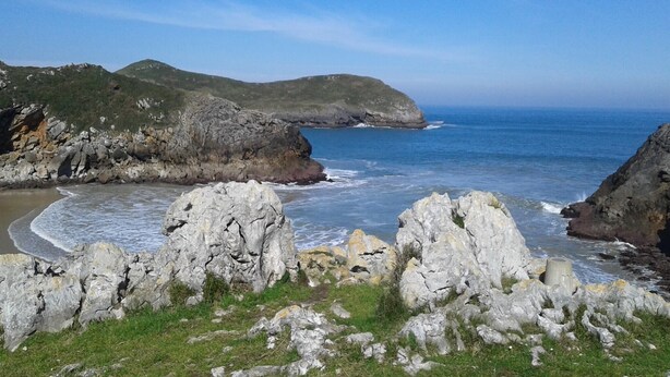 A coastal landscape with rocky terrain, a small beach, and a clear view of the ocean. - Mansion in Nava with Pool & Terrace (Nava - Asturias)