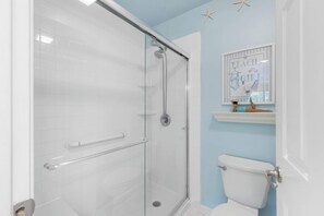 Shower, hair dryer, towels, shampoo
