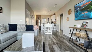 A modern living room with a sofa, coffee table, and a TV. - 3111 Close to Silver Dollar City, Save 10% on tix (Branson)