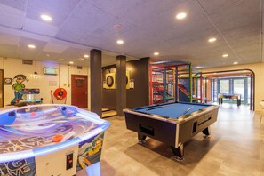 Enjoy a game of pool or table tennis in this lively indoor recreational area.