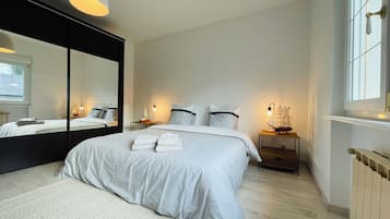 2 habitaciones, tabla de planchar con plancha y ropa de cama