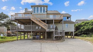 A multi-story house with a wooden deck and a covered porch. - Taylor, Ships Watch Community in Duck, NC (Kitty Hawk)