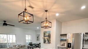 A modern kitchen with a large island, stainless steel appliances, and pendant lighting. - Bay Views, Short beach walk, 3/2, Community Pool (Port St. Joe)