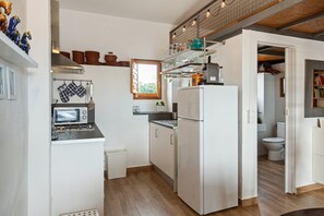 Fridge, microwave, stovetop, coffee/tea maker