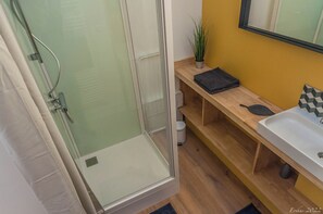 Shower, hair dryer, towels, toilet paper