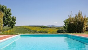 A rectangular swimming pool with clear blue water, surrounded by a brick deck. - Peccioli Family Retreat w/ Fun (Peccioli)