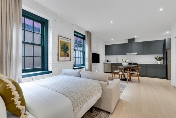 1 bedroom, desk, iron/ironing board, travel crib