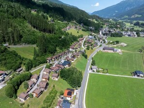 A residential area with houses, a church, and a road. - Chalet with Mountain Views in Wald (Wald-Königsleiten)