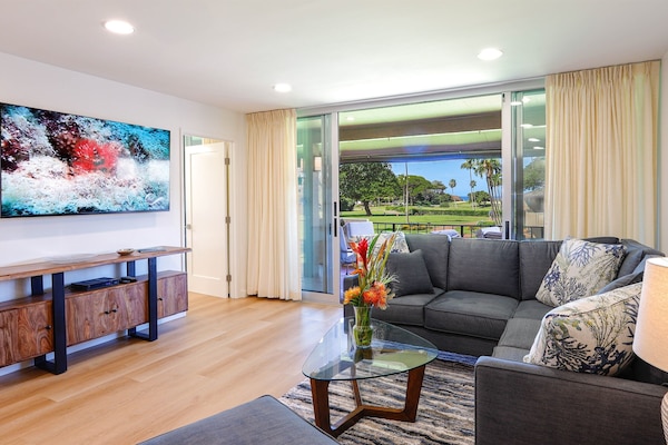 Living room opens to lanai with ocean views