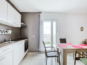 Fridge, oven, stovetop, dining tables
