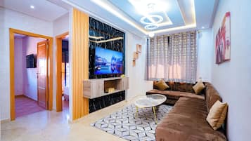 Appartement Deluxe | Coin séjour | Télévision