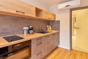 Fridge, microwave, stovetop, coffee/tea maker