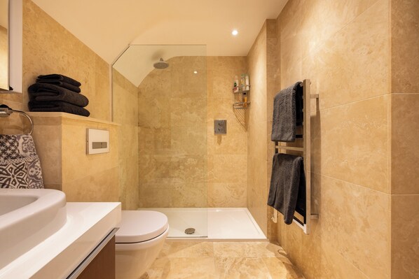 Shower, hair dryer, towels, soap