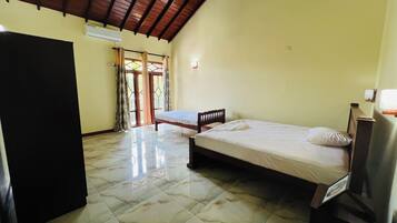 Triple Room, Balcony, Garden View | Iron/ironing board, free WiFi