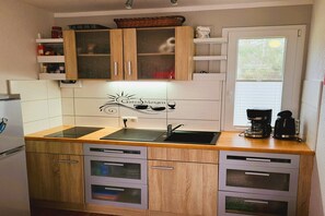 Fridge, microwave, stovetop, coffee/tea maker