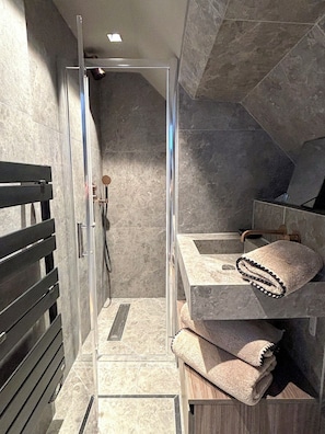 Shower, hair dryer, towels, toilet paper