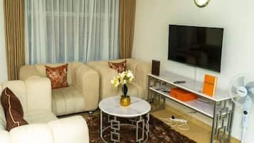 Deluxe Apartment, Balcony, City View | Living area | 24-inch Smart TV with digital channels