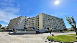 A modern hotel with a unique architectural design, featuring a central atrium and multiple floors. - Caorle Holiday Home with Terrace (Caorle (VE))