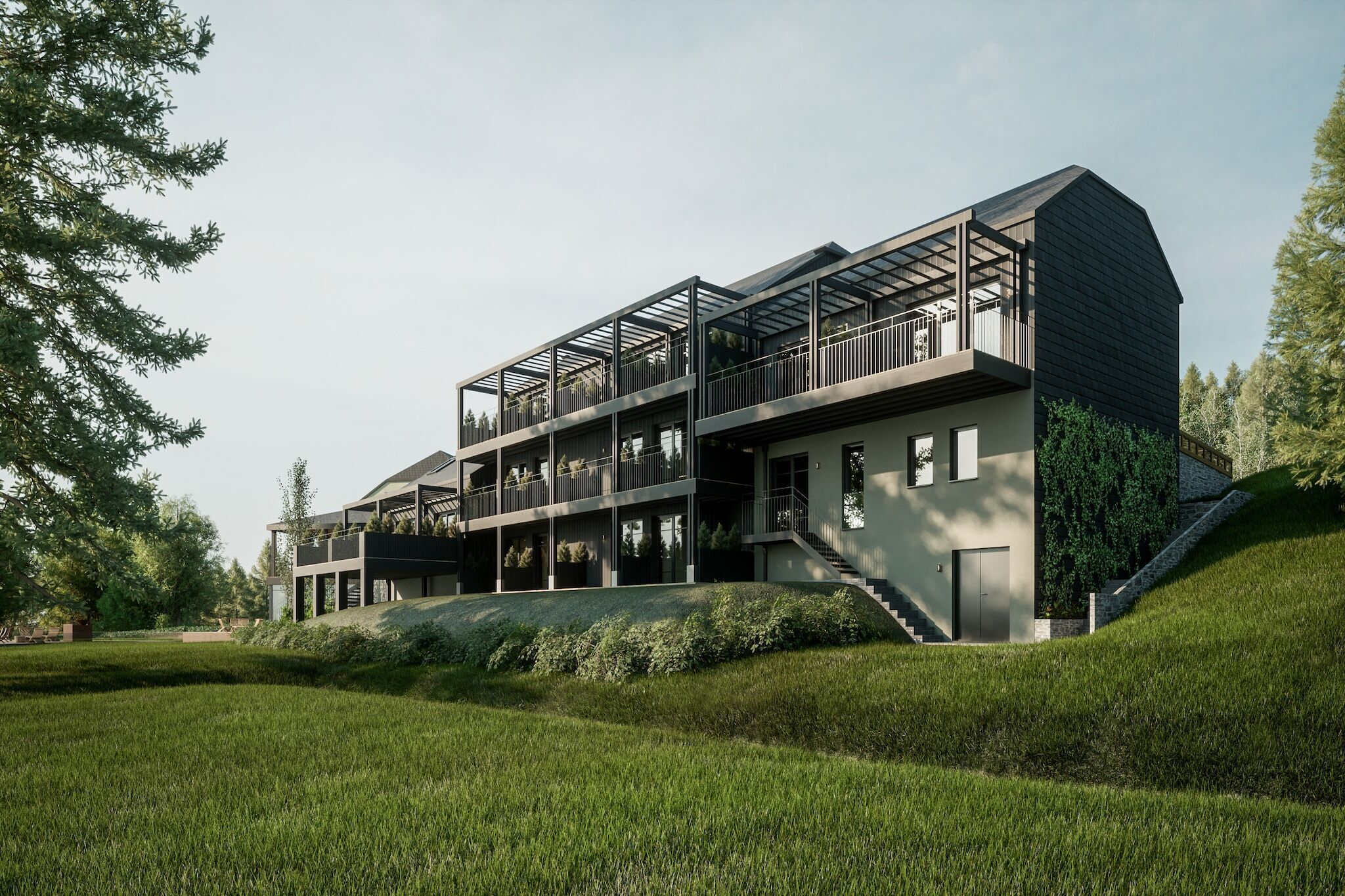 A modern multi-story building with a flat roof, large windows, and a balcony on the upper level.
