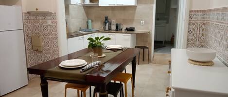 Fridge, coffee/tea maker, toaster, cookware/dishes/utensils